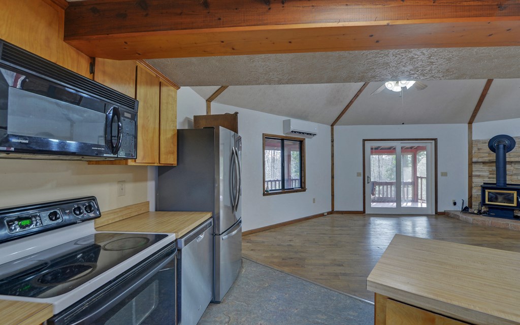 15 Trails End Road Blue Ridge, GA 30513 - Photo 10 of 46 a kitchen with stainless steel appliances granite countertop a stove a sink and a microwave