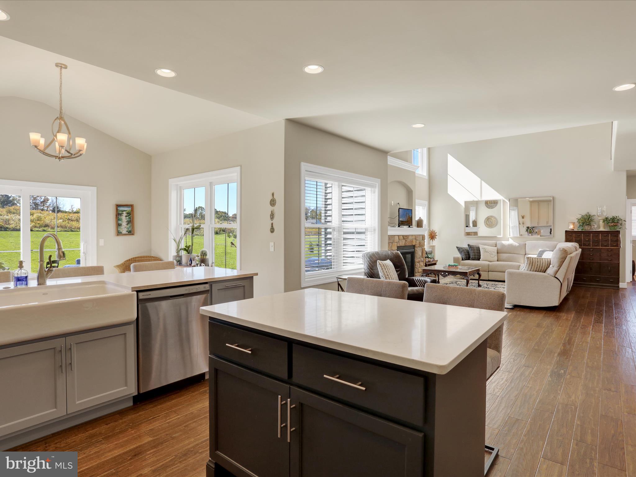 344 Hampshire Road Reading, PA 19608 - Photo 16 of 43 a view of a kitchen counter space a sink wooden floor and living room view