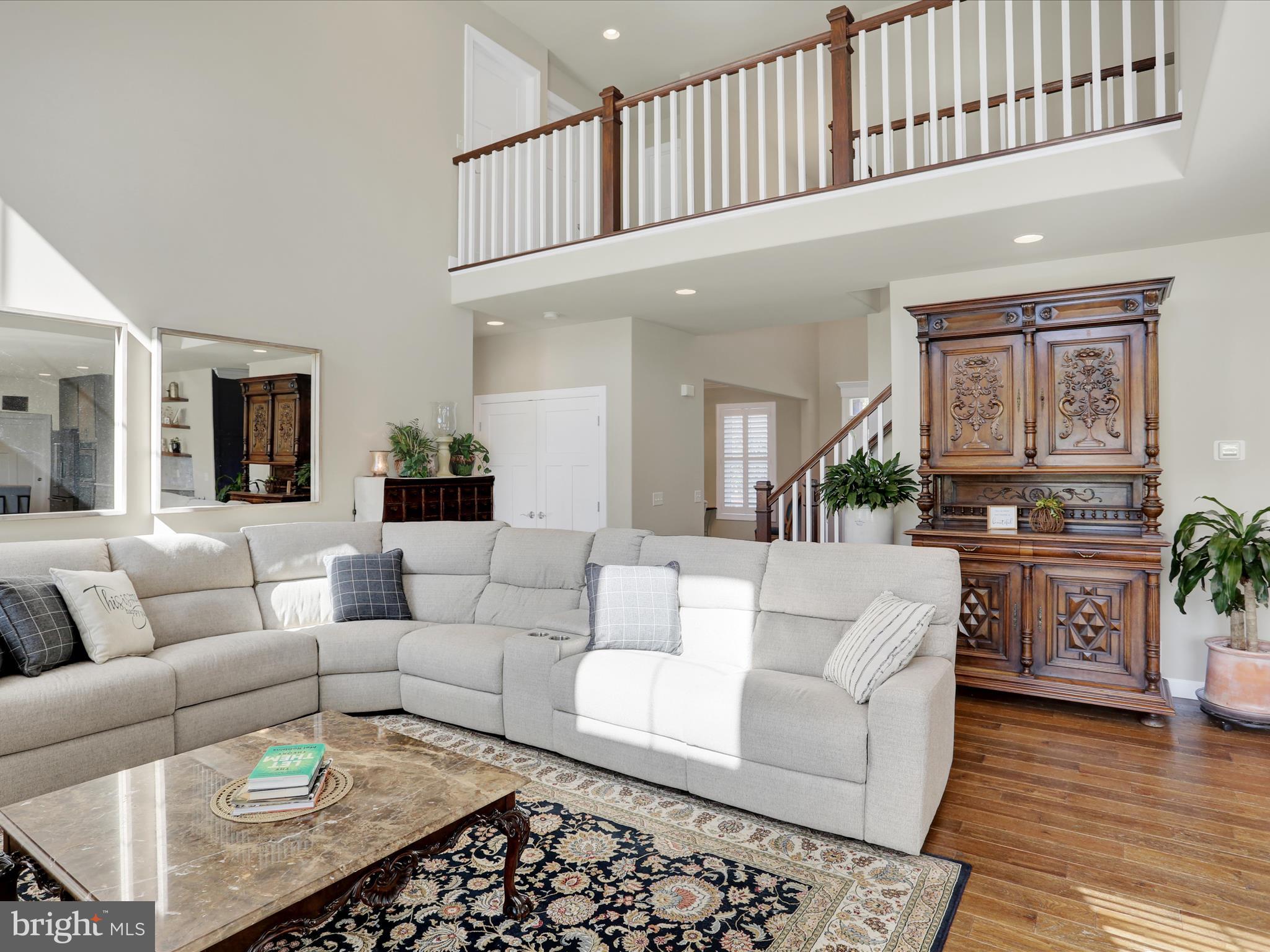 344 Hampshire Road Reading, PA 19608 - Photo 20 of 43 a living room with furniture a rug and a kitchen view