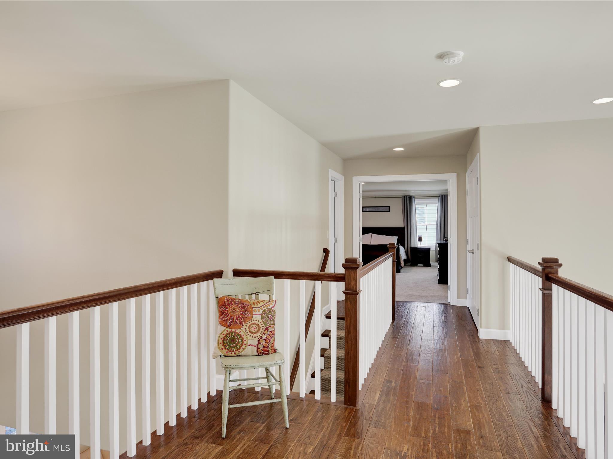 344 Hampshire Road Reading, PA 19608 - Photo 23 of 43 a view of a hallway with wooden floor staircase and a living room
