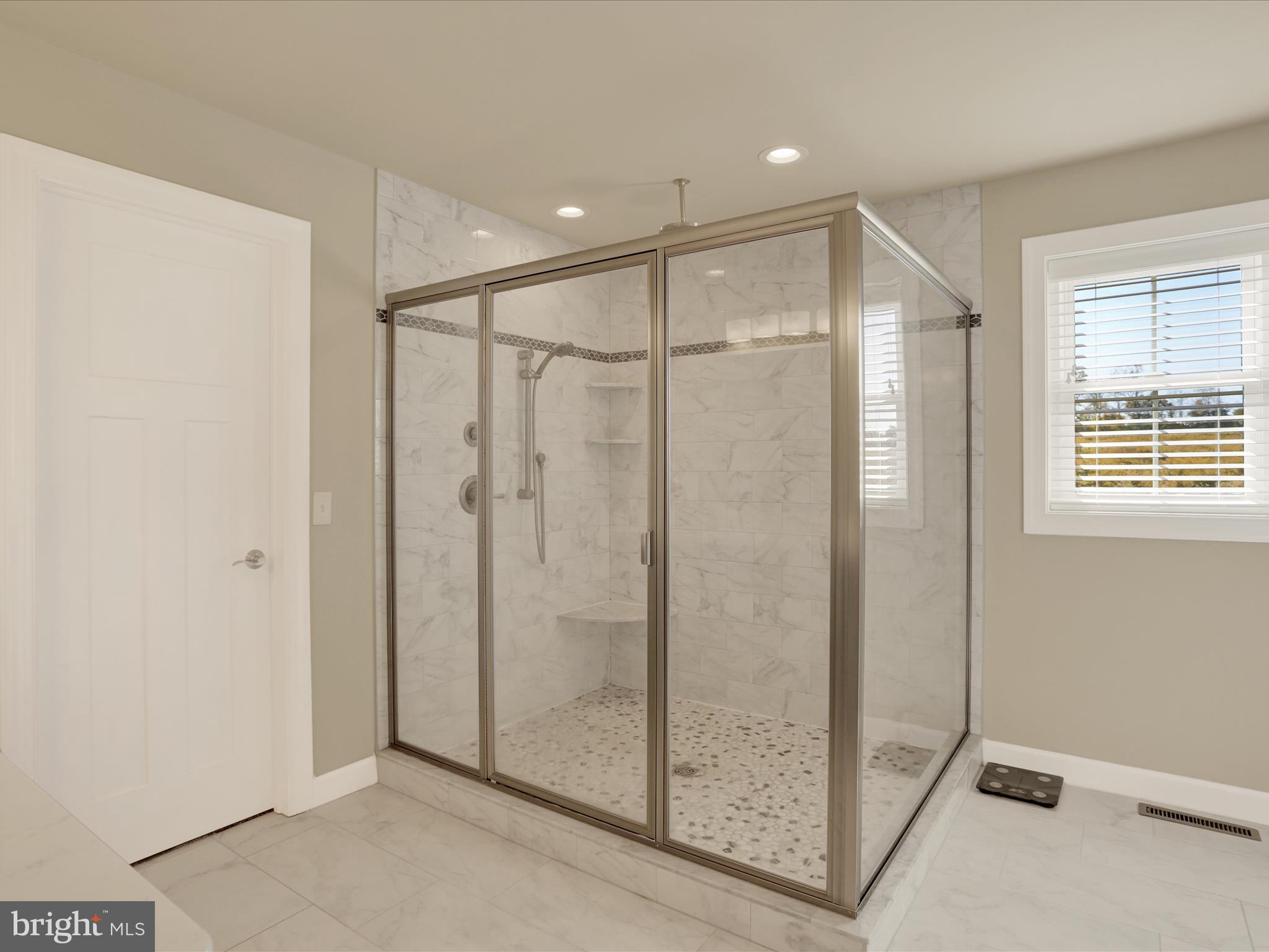 344 Hampshire Road Reading, PA 19608 - Photo 27 of 43 a bathroom with a shower and a glass door