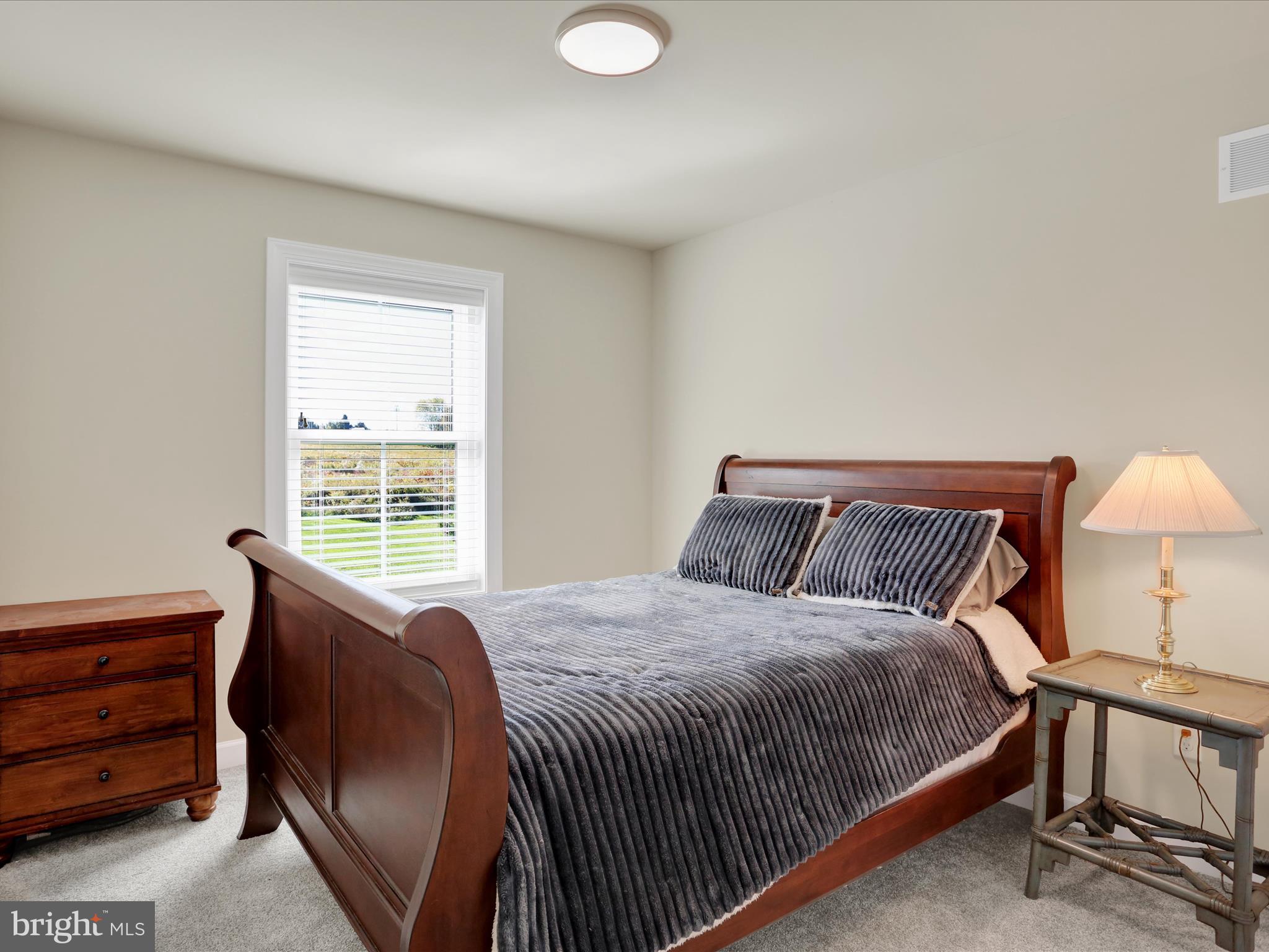 344 Hampshire Road Reading, PA 19608 - Photo 31 of 43 a bed sitting in a bedroom next to a window
