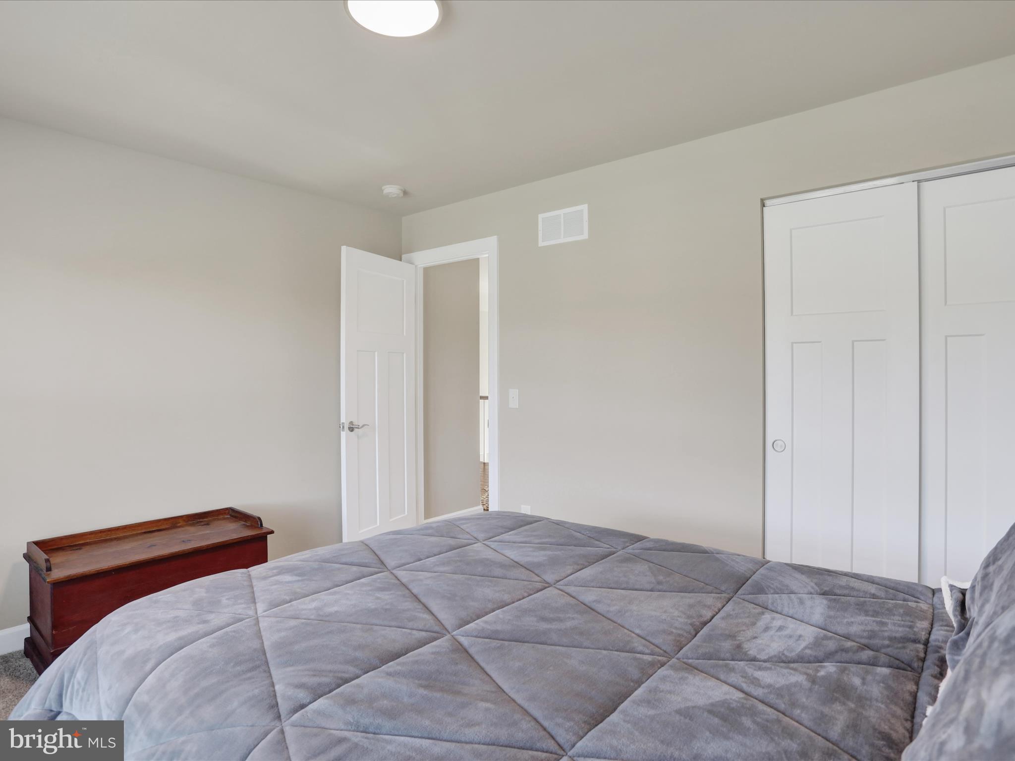 344 Hampshire Road Reading, PA 19608 - Photo 33 of 43 a bedroom with a bed and a painting on the wall
