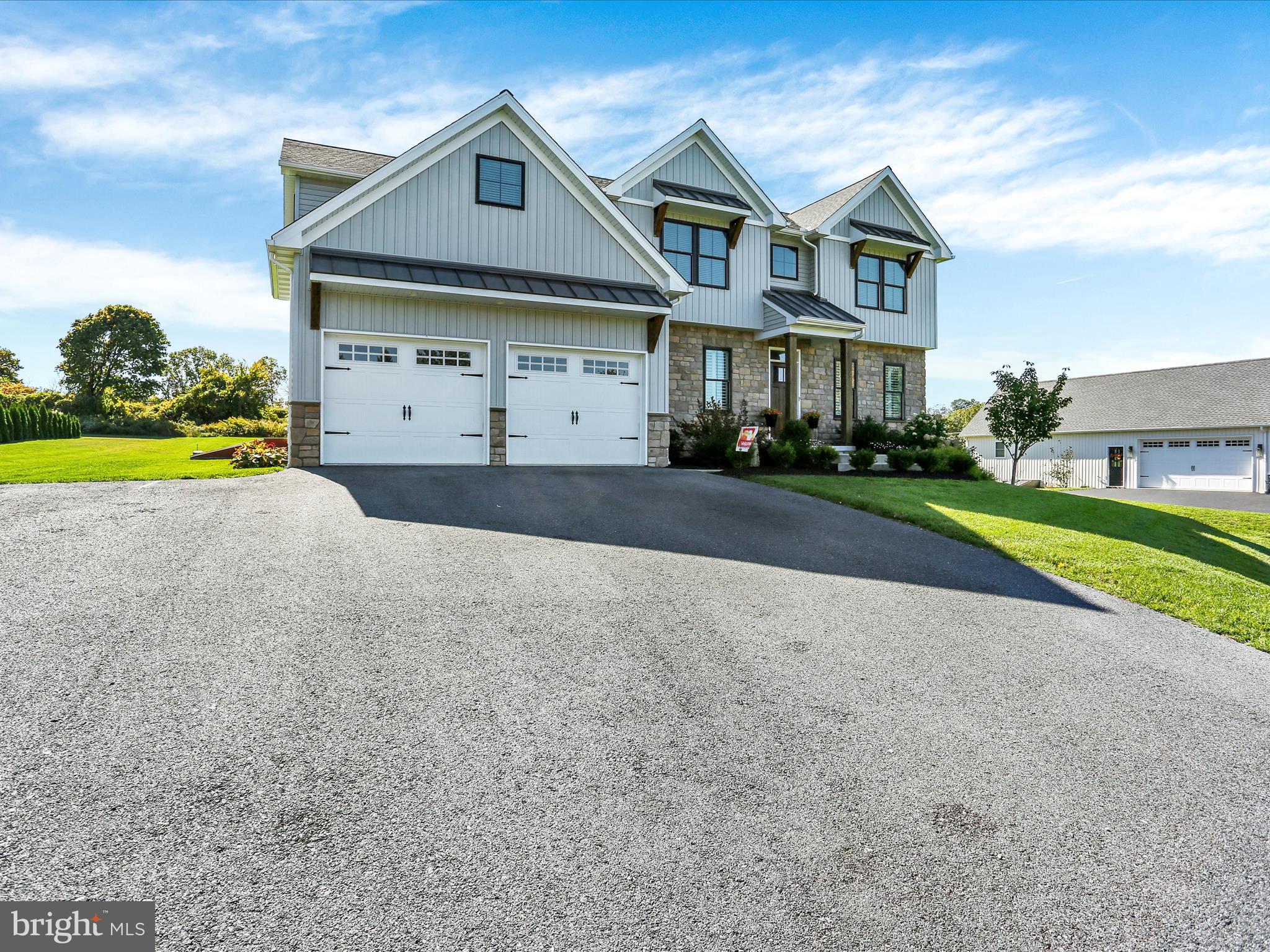 344 Hampshire Road Reading, PA 19608 - Photo 36 of 43 a front view of a house with a yard and garage