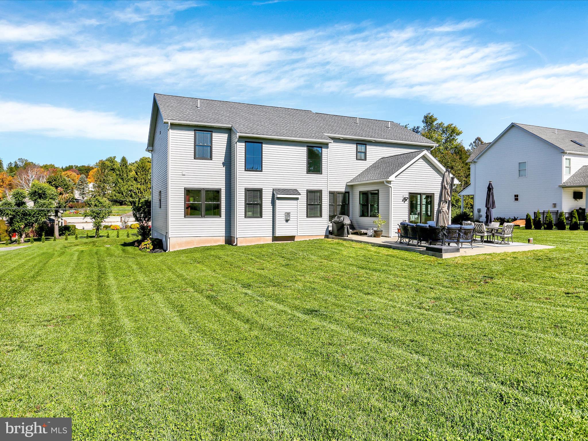 344 Hampshire Road Reading, PA 19608 - Photo 38 of 43 a front view of a house with a yard table and chairs