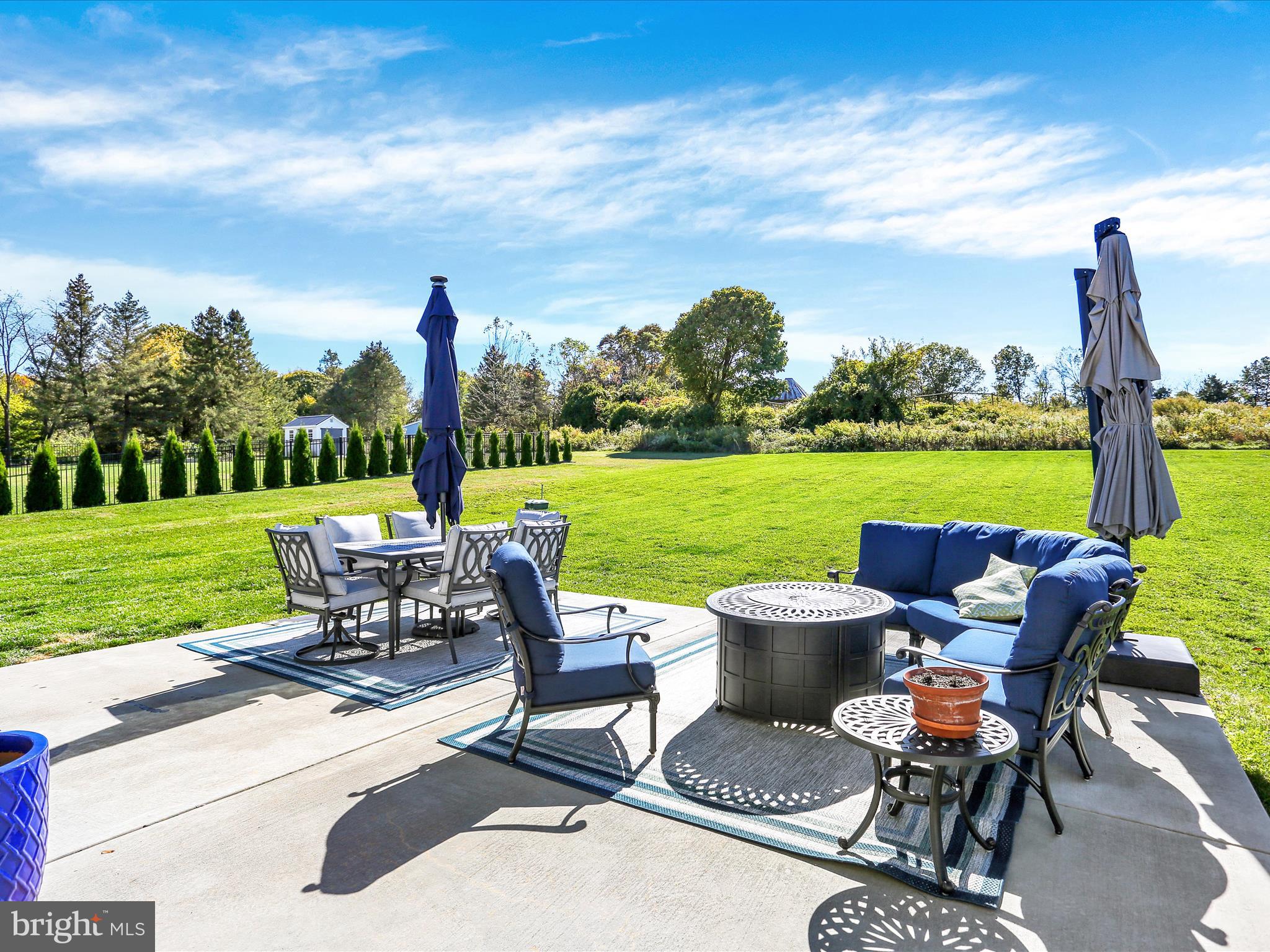 344 Hampshire Road Reading, PA 19608 - Photo 40 of 43 a view of a patio with a table chairs and a garden
