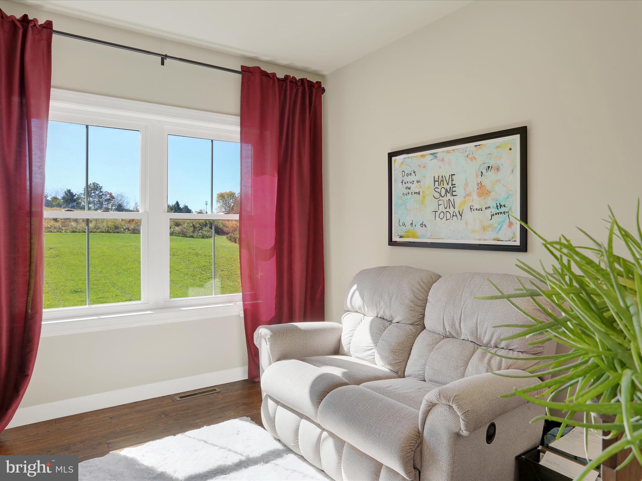 344 Hampshire Road Reading, PA 19608 - Photo 9 of 43 a living room with furniture and a large window