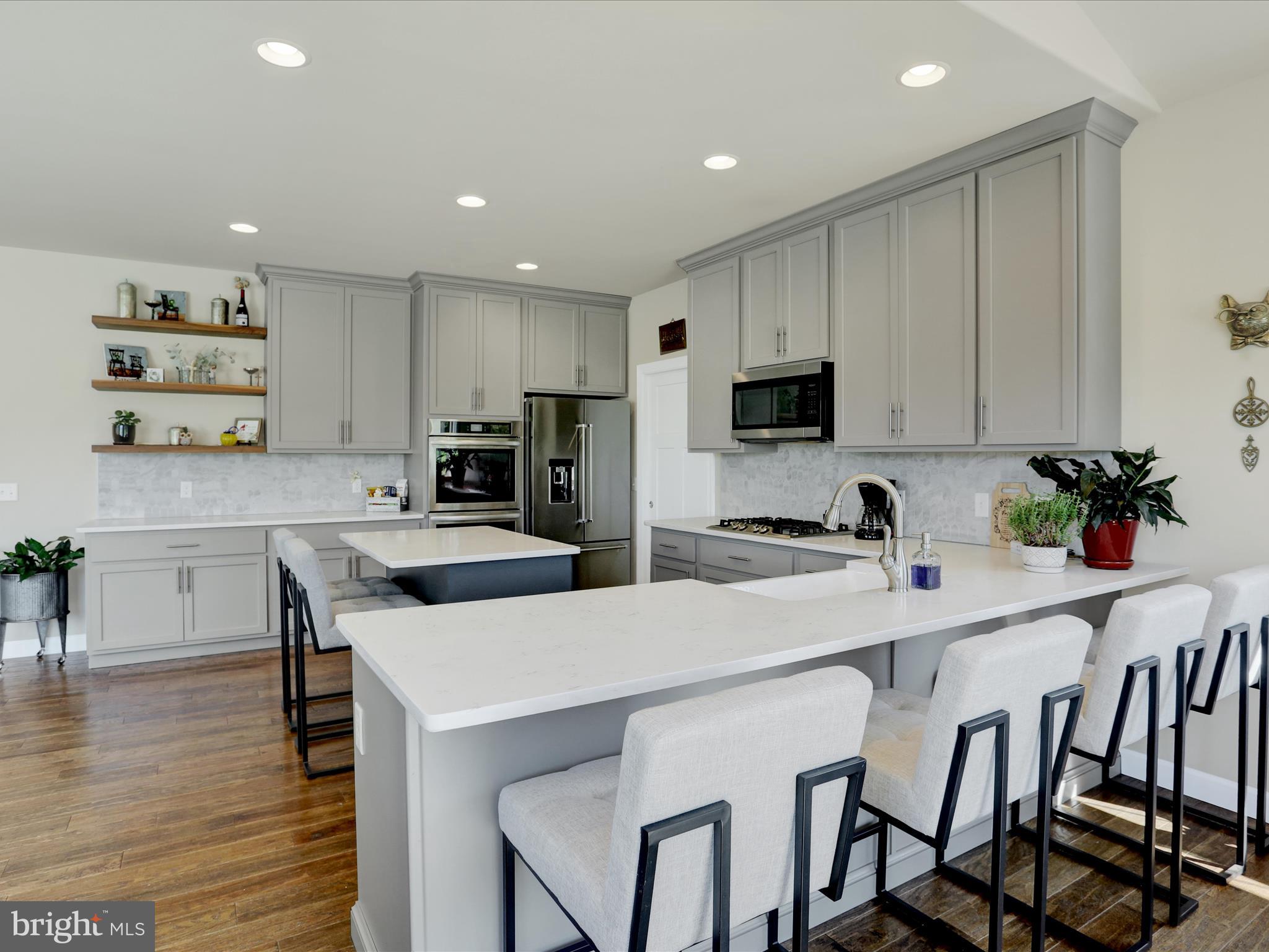 344 Hampshire Road Reading, PA 19608 - Photo 10 of 43 a kitchen with a dining table chairs and cabinets