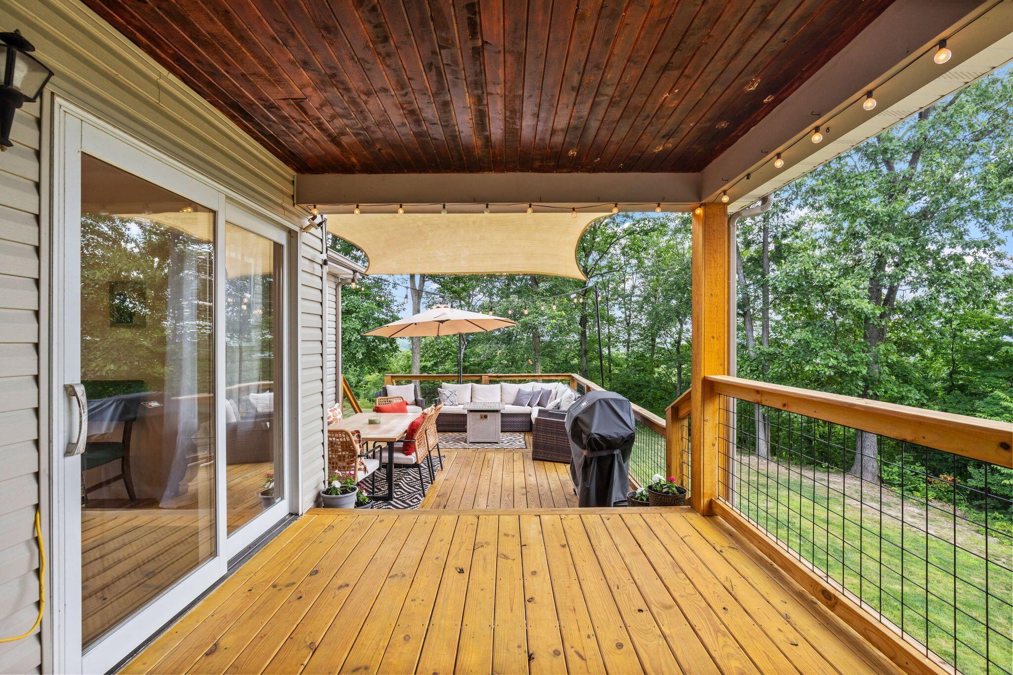 10446 Rich Hollow Road Southwest Lancaster, OH 43130 - Photo 80 of 83 Covered outdoor deck featuring natural wood flooring and a rich wood-paneled ceiling