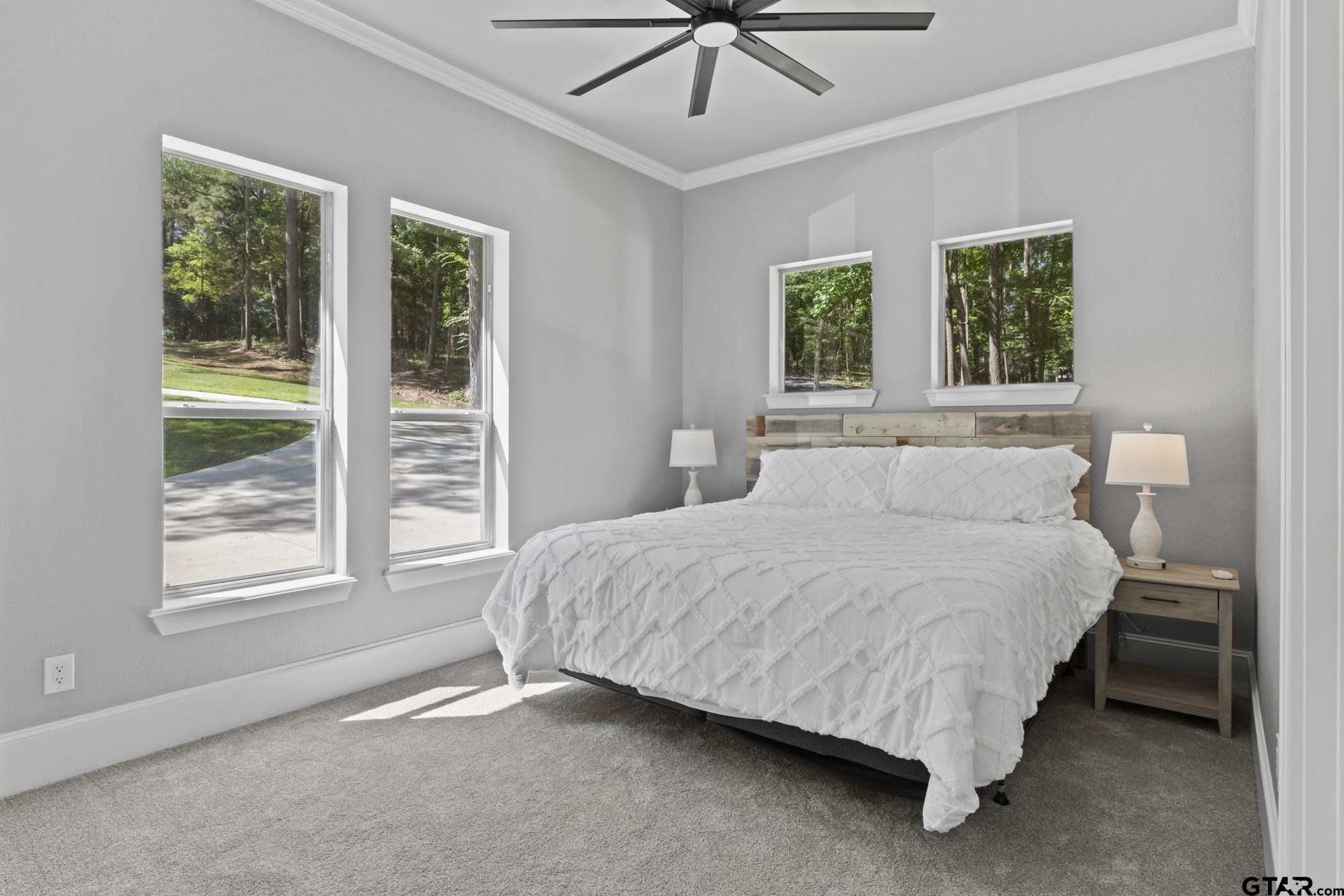 18630 Eastside Road Troup, TX 75789 - Photo 21 of 47 a spacious bedroom with a bed and a window