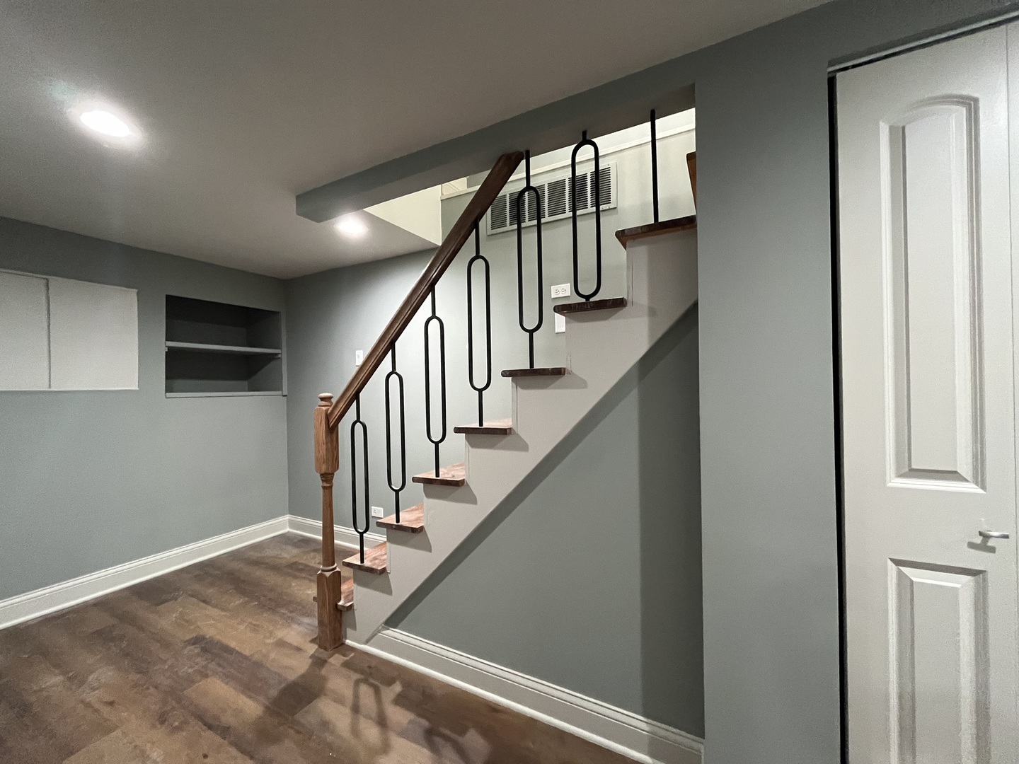 1446 West Irving Park Road, Unit 1 Chicago, IL 60613 - Photo 11 of 24 a view of staircase with wooden floor and fan