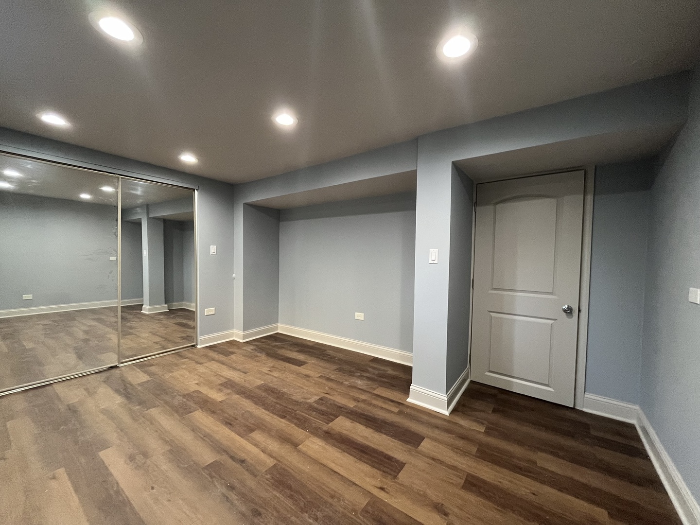 1446 West Irving Park Road, Unit 1 Chicago, IL 60613 - Photo 17 of 24 an empty room with wooden floor and closet