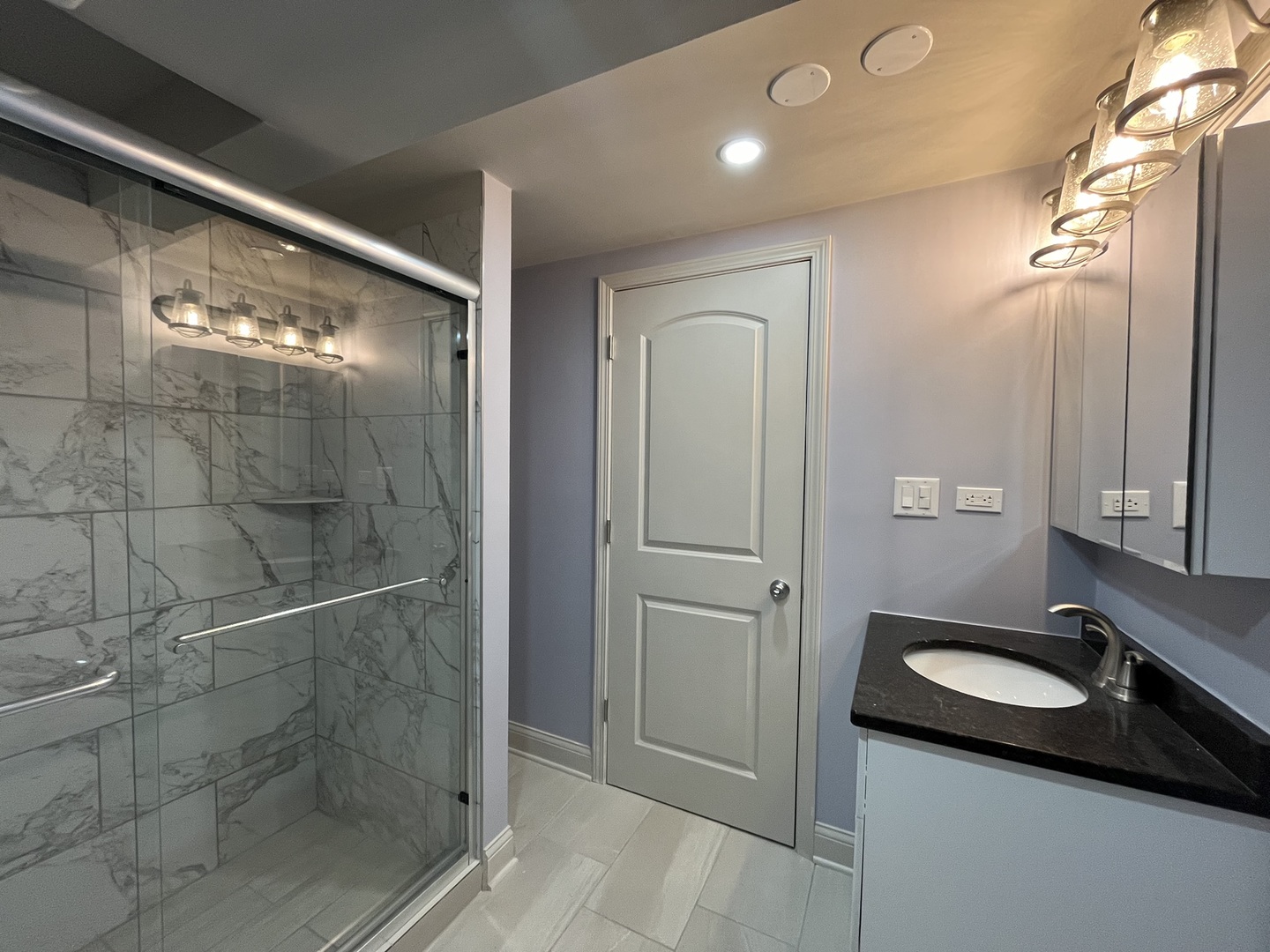 1446 West Irving Park Road, Unit 1 Chicago, IL 60613 - Photo 20 of 24 a bathroom with a sink a toilet and shower