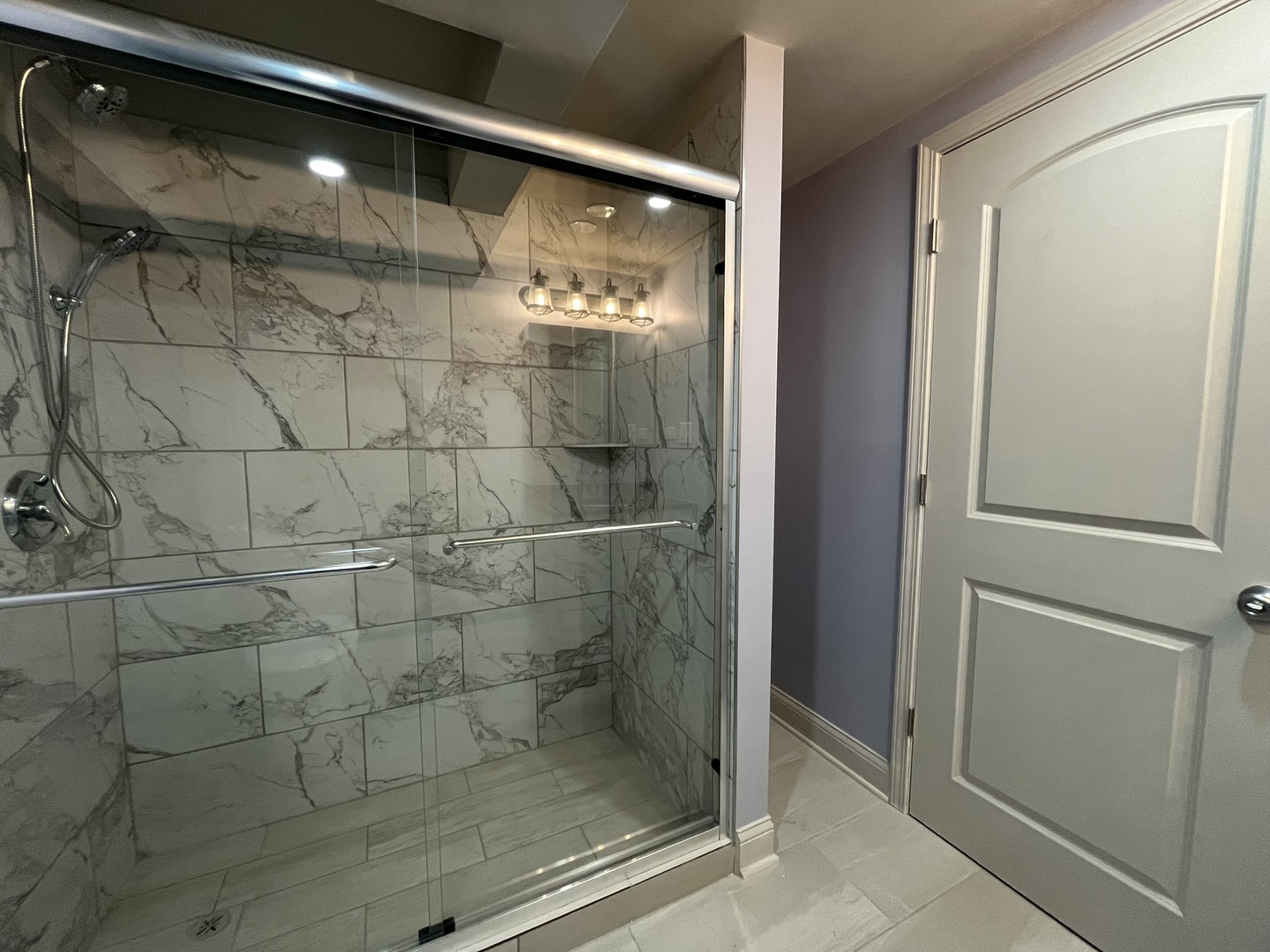 1446 West Irving Park Road, Unit 1 Chicago, IL 60613 - Photo 21 of 24 a bathroom with a glass shower door