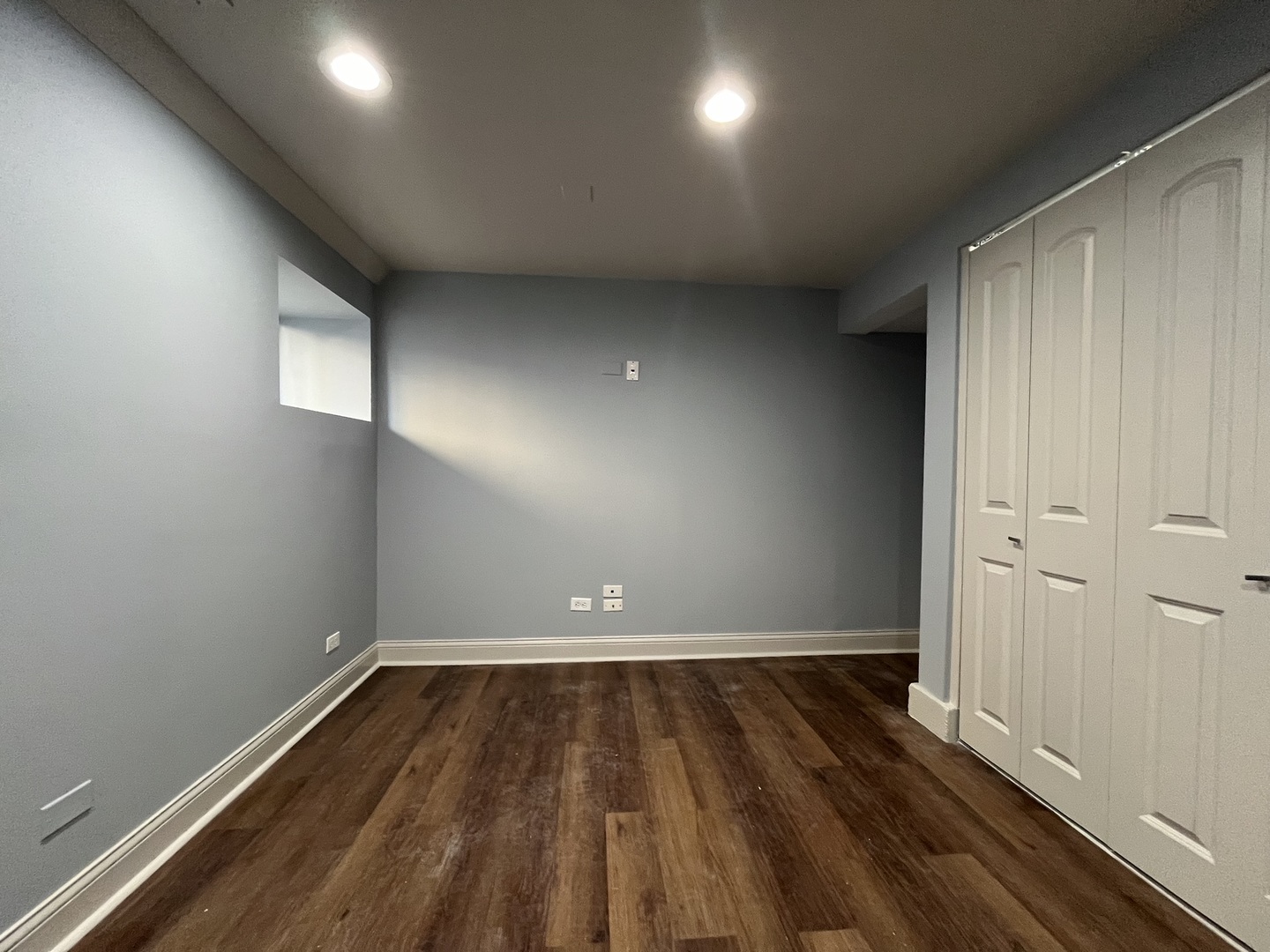 1446 West Irving Park Road, Unit 1 Chicago, IL 60613 - Photo 24 of 45 an empty room with wooden floor and windows