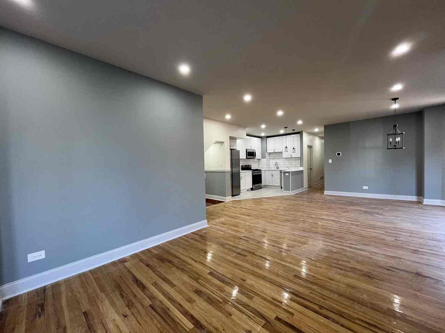 1446 West Irving Park Road, Unit 1 Chicago, IL 60613 - Photo 10 of 45 a view of empty room with a kitchen