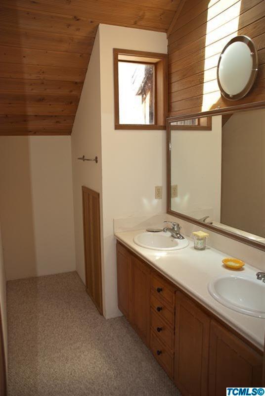 40567 Cherokee Oaks Drive Three Rivers, CA 93271 - Photo 13 of 16 a bathroom with a sink and a mirror