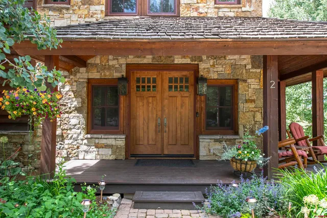 a front view of a building with potted plants