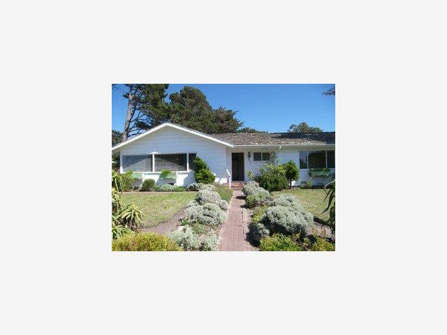 3003 Cormorant Road Pebble Beach, CA 93953 - Photo 1 of 9 a balcony with a bench and plants