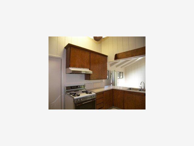 3003 Cormorant Road Pebble Beach, CA 93953 - Photo 5 of 9 a kitchen with stainless steel appliances a sink and stove top oven