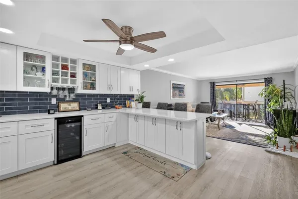 a kitchen with cabinets a sink and appliances