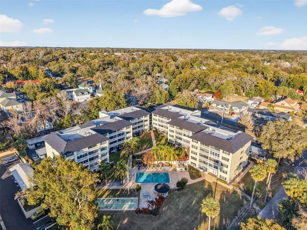 an aerial view of residential building and ocean