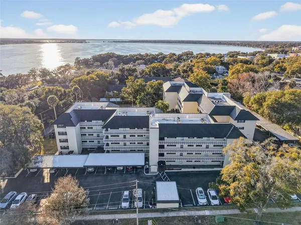 an aerial view of a house with a lake view