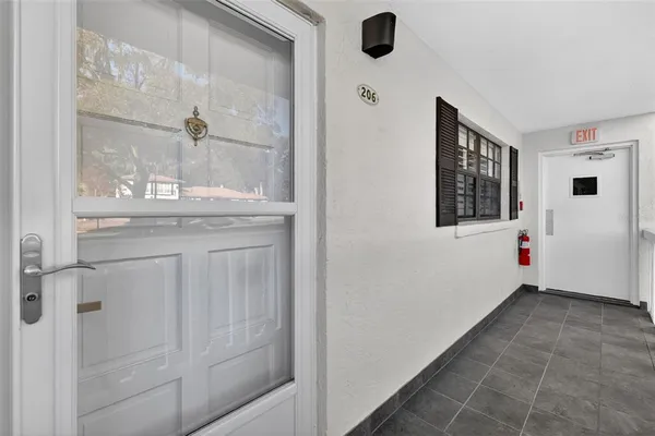 a bathroom with a granite countertop sink mirror and vanity