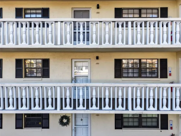 a view of a porch with wooden floor
