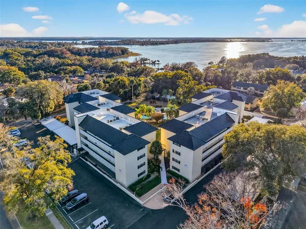 an aerial view of a house with a ocean view