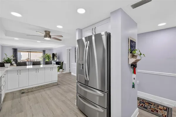 a kitchen with stainless steel appliances a refrigerator and a sink