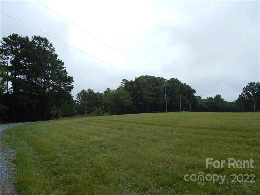 5312 Davis Road, Unit A Waxhaw, NC 28173 - Photo 10 of 12 a view of a field of grass and trees