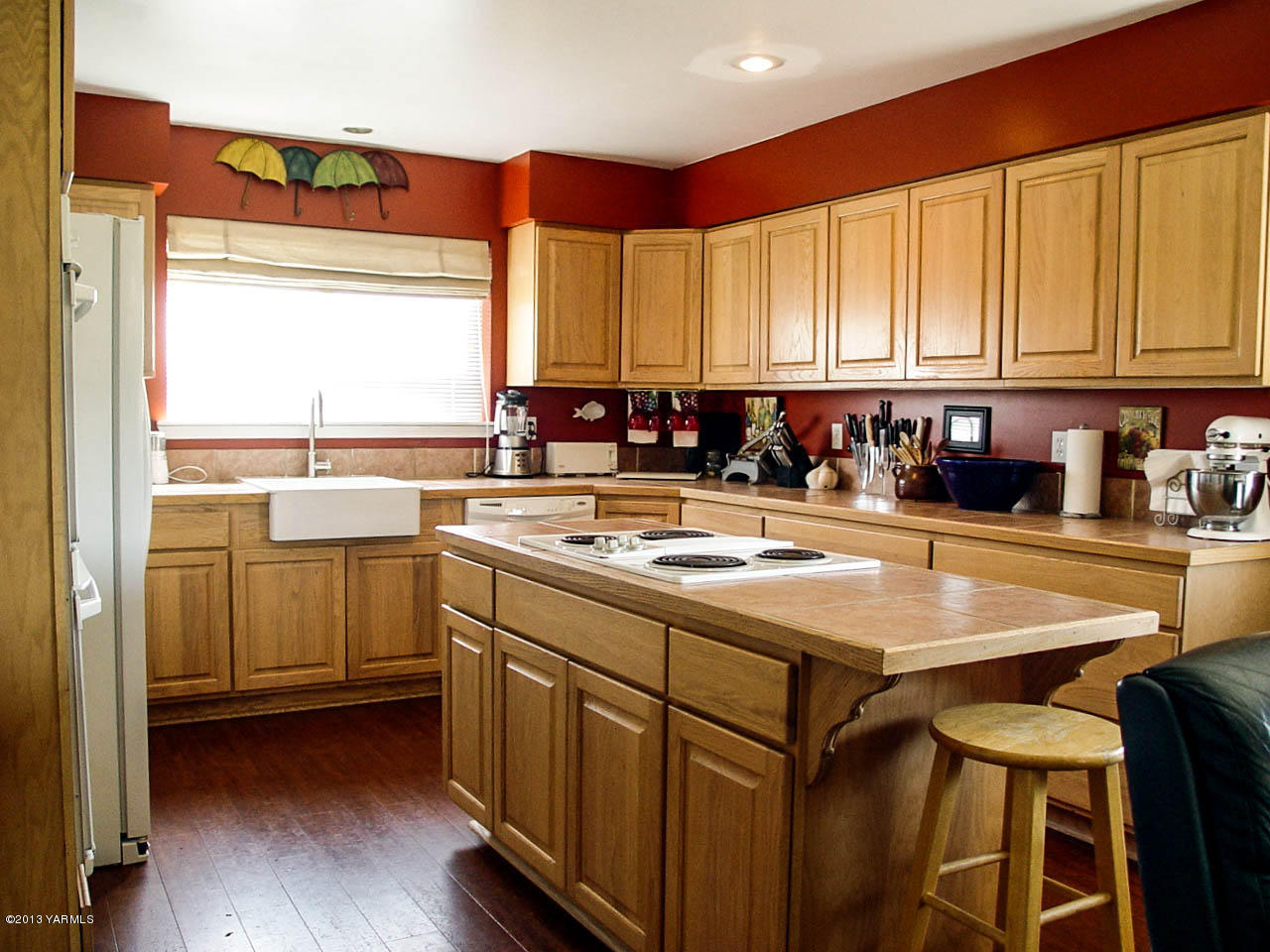 531 Winchester Road Yakima, WA 98908 - Photo 9 of 35 a kitchen with sink cabinets and wooden floor