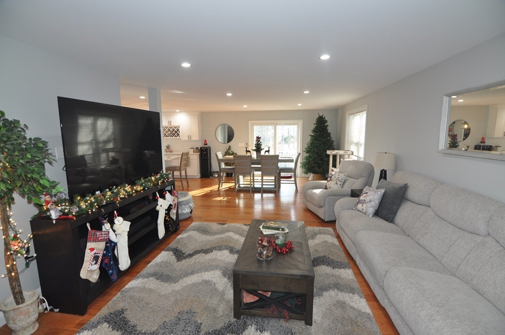 47 Maple Street, Unit A Middleton, MA 01949 - Photo 11 of 29 a living room with furniture and a flat screen tv