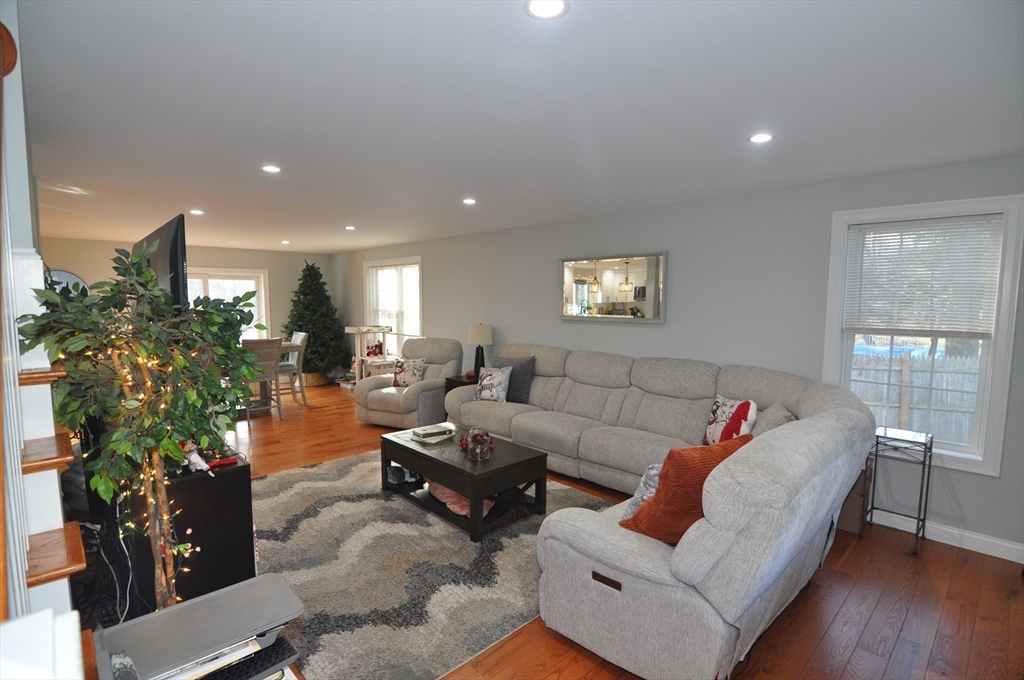 47 Maple Street, Unit A Middleton, MA 01949 - Photo 15 of 29 a living room with furniture and a potted plant
