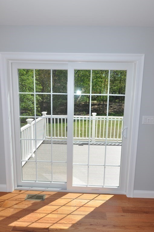 47 Maple Street, Unit A Middleton, MA 01949 - Photo 16 of 29 a view of a house with a backyard