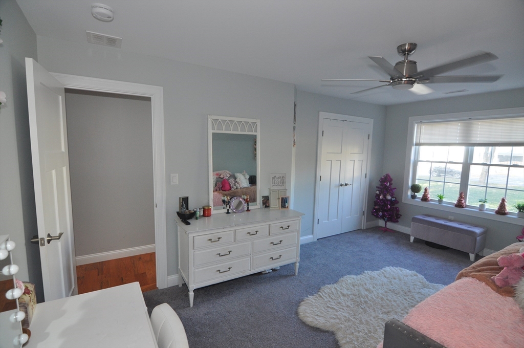 47 Maple Street, Unit A Middleton, MA 01949 - Photo 27 of 29 a living room with furniture and a window