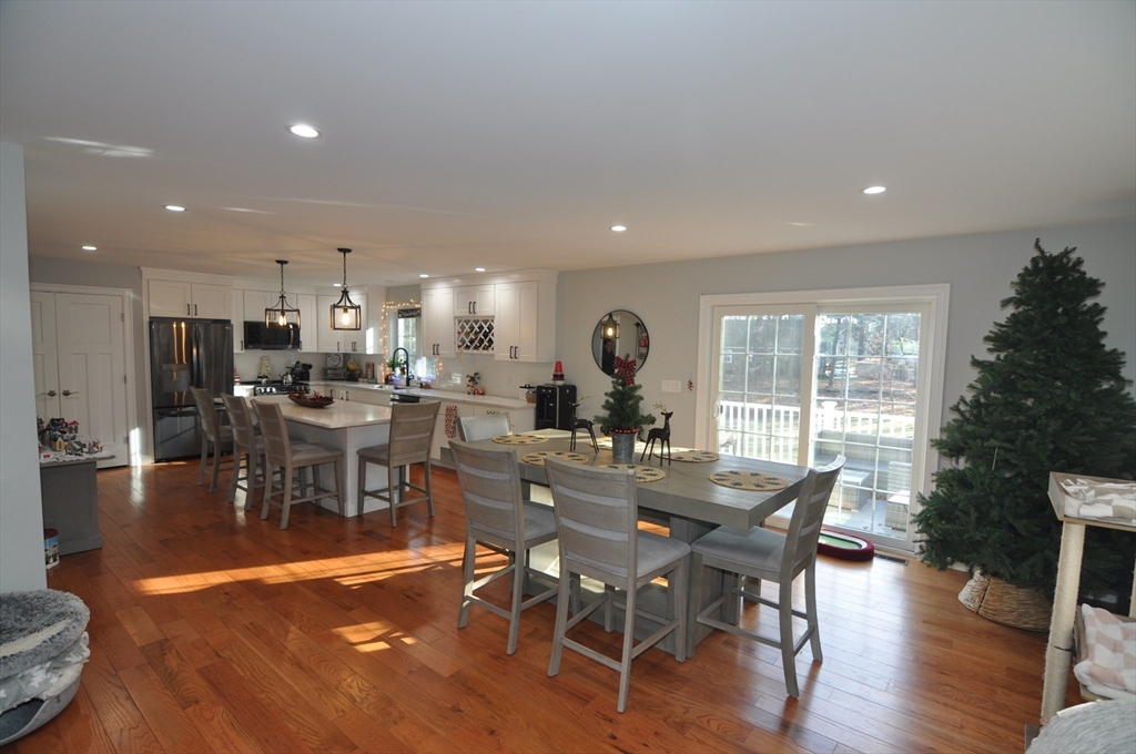 47 Maple Street, Unit A Middleton, MA 01949 - Photo 10 of 29 a view of a dining room with furniture window and wooden floor