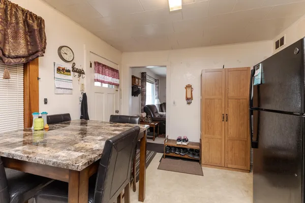 a kitchen with stainless steel appliances granite countertop a refrigerator and a stove