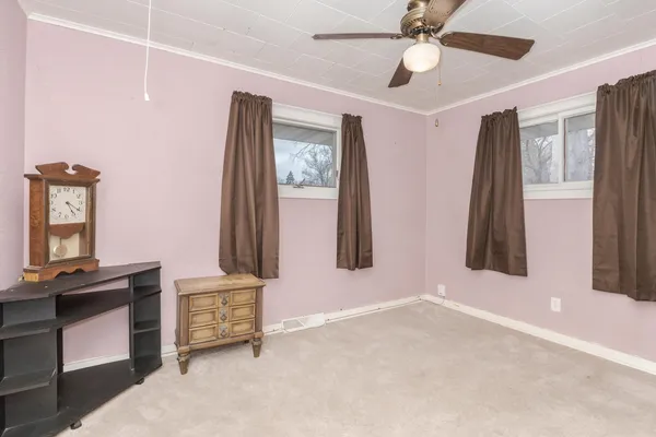 a view of room with window and ceiling fan