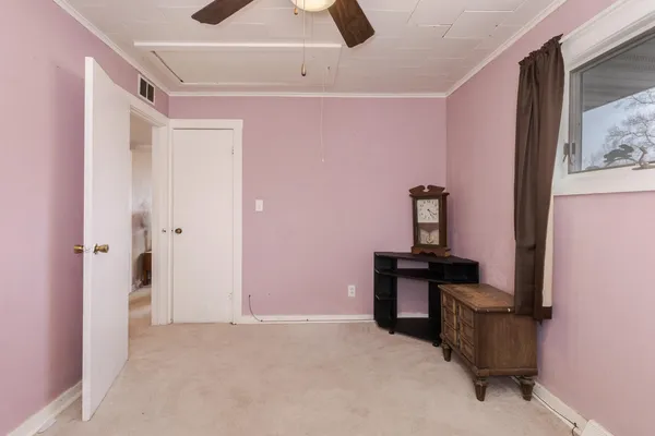 a view of a livingroom with furniture and cabinet