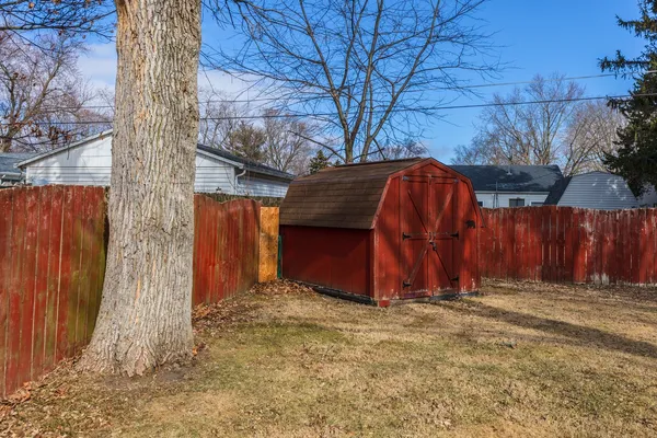a house that has a tree in front of it