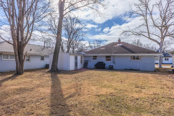 a view of a pathway with a yard
