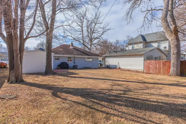 a view of a backyard of the house