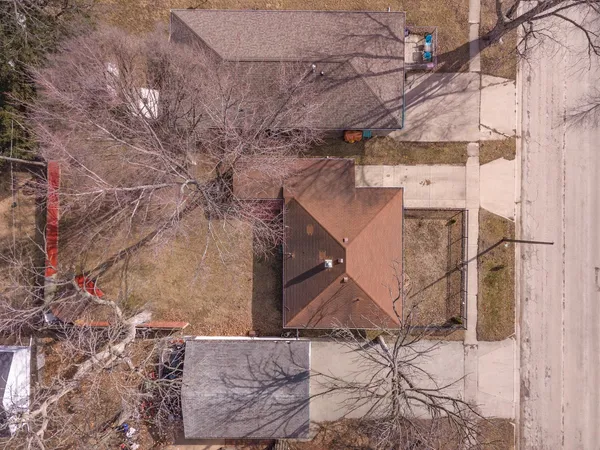 an aerial view of residential houses with outdoor space