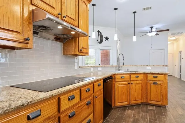 a living room with furniture kitchen view and a fireplace