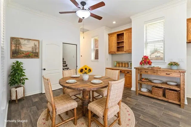 a kitchen with stainless steel appliances granite countertop a sink a stove and a wooden floors