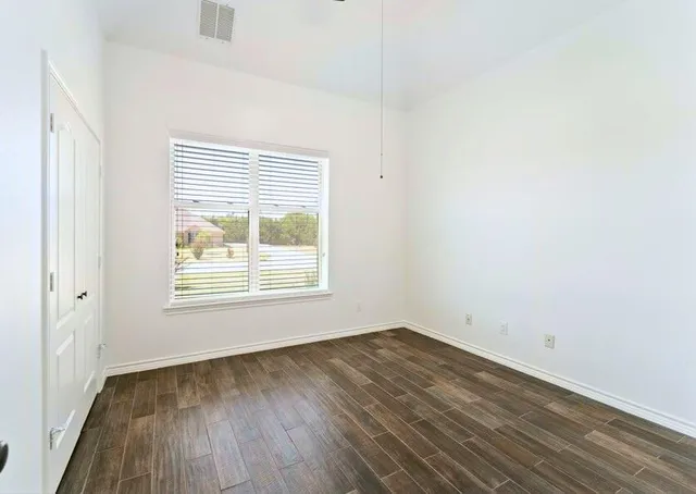 a bathroom with a bathtub sink and a window