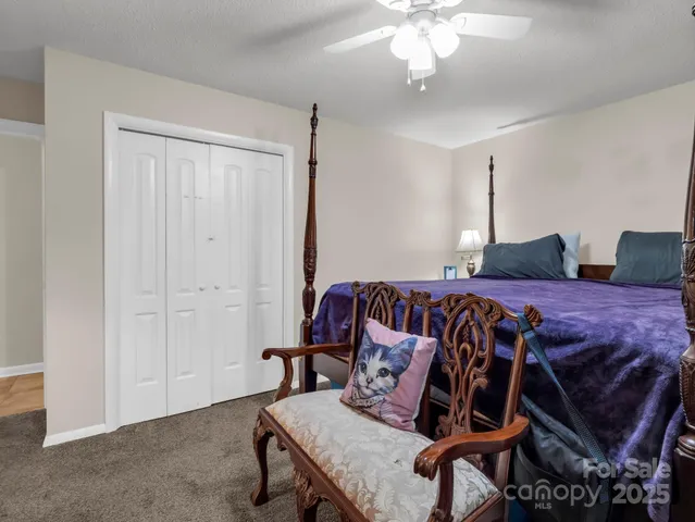 a bedroom with furniture and wooden floor