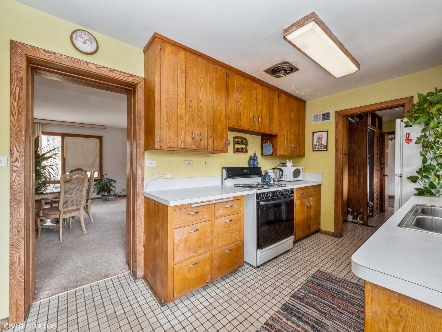 1762 West Palatine Road Palatine, IL 60067 - Photo 5 of 13 a kitchen with a refrigerator a stove top oven and a sink